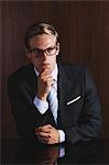 Businessman with glasses looking away