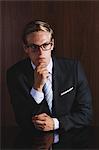 Businessman with glasses looking away