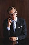 Businessman with glasses on the phone