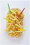 still life of french fries with plastic forks