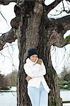 Woman standing in snowy field