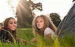 Teenage girls laying in tents