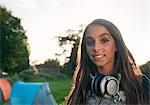 Teenage girl wearing headphones outdoors