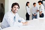 Businessman taking notes in meeting