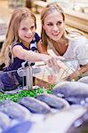 Mother and daughter in grocery store