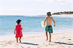 Children playing in sand on beach