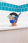 Boy wearing snorkel mask in bath