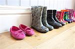 Childrens shoes lined up on floor