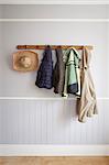 Coats and hat on coat rack