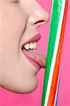 Close up of woman licking candy