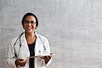 Portrait of a female doctor with digital tablet