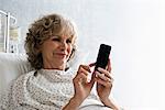 Female hospital patient using cellphone