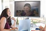 Businesswoman laughing in meeting