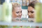 Women smelling soap in store