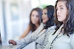 Businesswomen sitting at desk