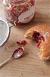 Doughnuts and jam on table