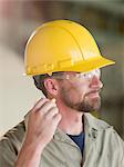Engineer wearing earplugs on site