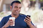 Man having cup of coffee outdoors