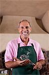 Older man baking in kitchen