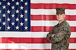 Serviceman in camouflage by US flag