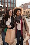 Women walking together on city street