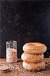 Stack of glazed donuts and sprinkles