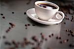 Cup of cappuccino with coffee beans