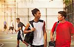 Men talking on basketball court