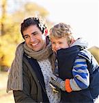 Father and son playing in park