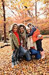 Family smiling together in park