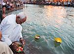 Devotees performing rituals at a ghat, Haridwar, Uttarakhand, India