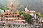 Facade of a multi-storied temple at the riverside, Trayambakeswar Temple, Lakshman Jhula, River Ganges, Rishikesh, Dehradun District, Uttarakhand, India