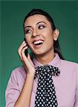 Businesswoman talking on a mobile phone and smiling