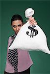 Businesswoman showing a money bag
