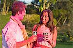 Couple celebrating Holi with glass of bhang