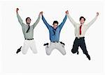 Three businessmen jumping