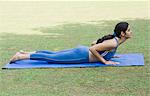 Woman doing Surya Namaskar (Sun Slautation)