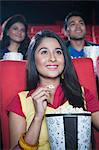 Youngsters watching movie in a cinema hall