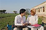 Farmer signing on the agreement of agriculture loan, Sonipat, Haryana, India