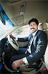 South Indian businessman driving the car