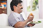 South Indian man having vada