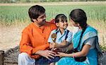 Rural couple enjoying the achievement of their daughter, Sohna, Haryana, India