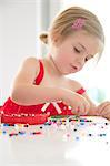 Girl Playing With Ironing Beads