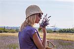 Young Woman Holding Bunch Of Lavender in Hands, Croatia, Dalmatia, Europe