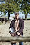 Man Holding Saddle, Baranja, Croatia, Europe