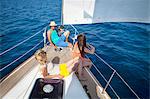 Croatia, Adriatic Sea, Young people on sailboat relaxing