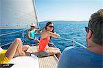 Croatia, Adriatic Sea, Young people on sailboat relaxing