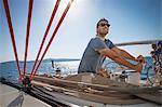 Croatia, Adriatic Sea, Young man on sailboat