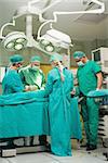 Team of surgeon working on a patient in a surgical room