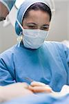 Doctor operating a patient in operating theater